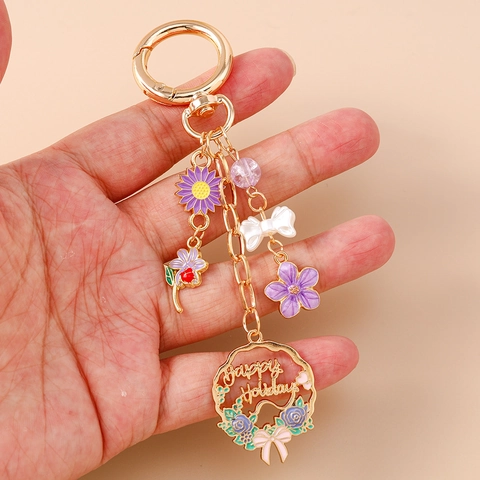 Llavero de Guirnalda de Flores y Lazo con Letras Happy Holidays Colgante de Bolso de Aleación de Zinc Regalo para Mujer
