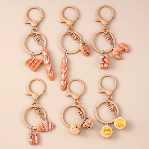 Porte-Clés Pain Créatif Simulation Nourriture Baguette Croissant Gaufre Tarte à l'Œuf Alliage de Zinc Résine Pendentif de Sac