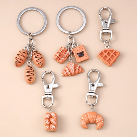 Porte-Clés Pain Créatif Simulation Nourriture Baguette Croissant Gaufre Tarte à l'Œuf Alliage de Zinc Résine Pendentif de Sac