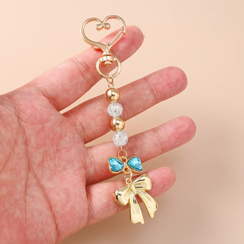 Portachiavi con Perline e Strass a Forma di Cuore e Fiocco in Lega di Zinco Ciondolo Borsa Squisito Dolce per Donna Ragazza Decorazione Quotidiana Regalo
