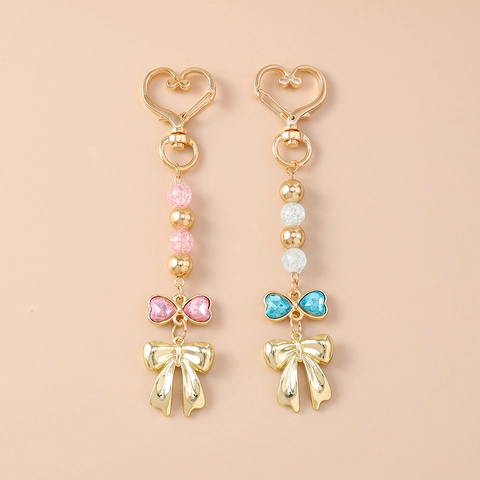 Portachiavi con Perline e Strass a Forma di Cuore e Fiocco in Lega di Zinco Ciondolo Borsa Squisito Dolce per Donna Ragazza Decorazione Quotidiana Regalo