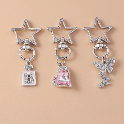 Porte-clés de Luxe en Alliage Strass Flacon de Parfum Cœur Papillon pour Femme Fermoir en Étoile Pendentif de Sac