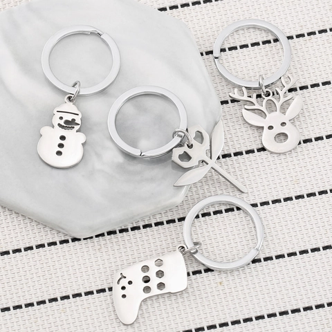 Ensemble Porte-clés de Noël en Acier Inoxydable Pendentif Ajouré Flocon de Neige Renne Bonhomme de Neige Chaussette Cloche Bijou Sac