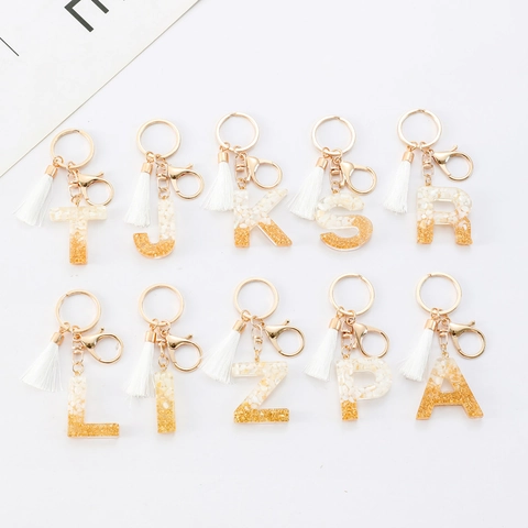 Porte-clés Lettre Initiale Alphabet Avec Frange Blanche Pendentif en Résine Feuille d'Or pour Sac Femmes Bijoux de Mode
