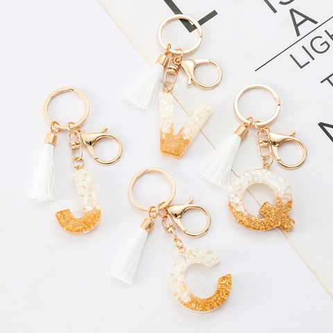 Porte-clés Lettre Initiale Alphabet Avec Frange Blanche Pendentif en Résine Feuille d'Or pour Sac Femmes Bijoux de Mode