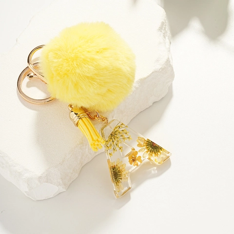 Fashion Yellow Alphabet Keychain With Faux Fur Pom Pom Tassel Resin Dried Flower Initial Letter Key Ring Bag Charm Pendant For Women