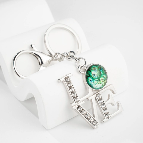Kreativer Pfauenfeder Zeitjuwel Metall Schlüsselanhänger Mit Strass LOVE Buchstabe Taschenanhänger Silber Schlüsselring Damen