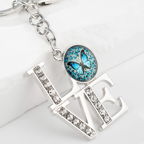Porte-clés Lettres LOVE Strass Papillon Bleu Gemme du Temps Alliage Anneau Porte-clés Pendentif de Sac Mode Cadeau Bijoux Femme Homme