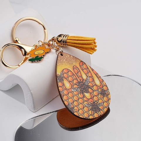 Kreativer Mode Bienenwaben Schlüsselanhänger Mit Gelber Quaste Smiley Blume Biene Grafik Metall Schlüsselring Taschenzubehör