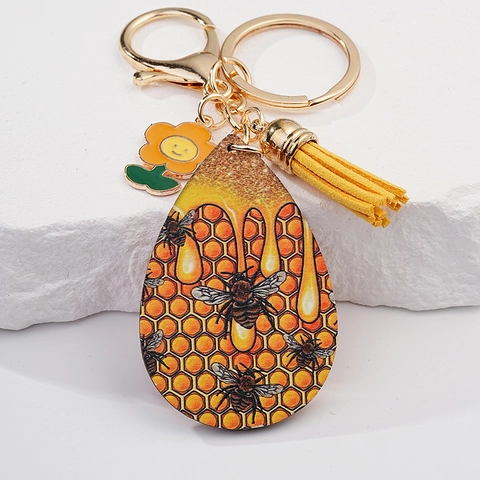 Kreativer Mode Bienenwaben Schlüsselanhänger Mit Gelber Quaste Smiley Blume Biene Grafik Metall Schlüsselring Taschenzubehör