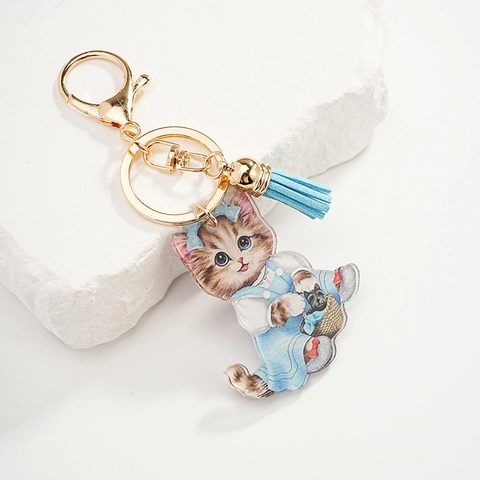 Mignon Dessin Animé Chat Acrylique Porte-clés Avec Pendentif Robe Bleue Fermoir Or Gland Bleu Clair Pendentif de Sac Décoratif Cadeau
