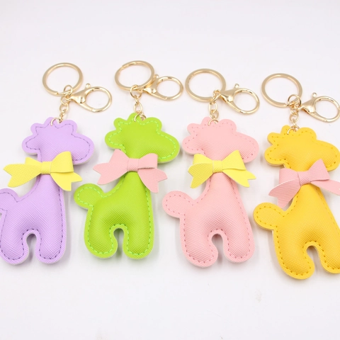 Süßer PU Leder Giraffe Schlüsselanhänger Mit Satin Schleife Saffiano Textur Tierform Tasche Anhänger Auto Schlüsselring Für Damen Mädchen
