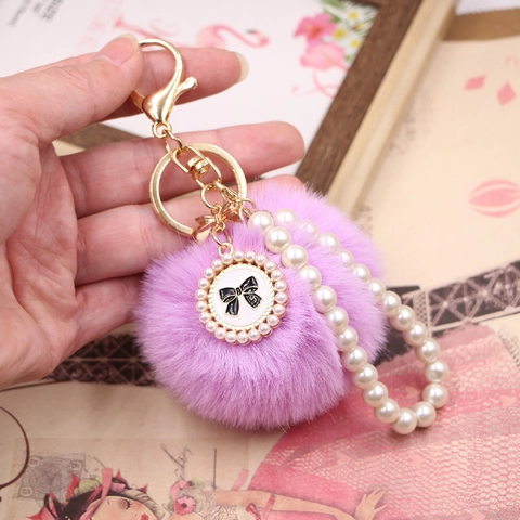 Porte-clés de Luxe en Alliage avec Boule de Fourrure Synthétique et Chaîne de Perles Artificielles Nœud Pendentif Élégant Décoration de Sac à Main