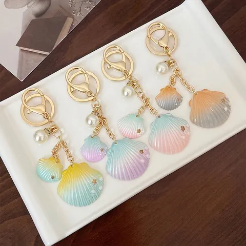 Portachiavi con Perla Artificial e Conchiglia Sfumata per Donna Ciondolo Borsa Tema Oceano Anello Portachiavi in Resina con Stelle Pendenti