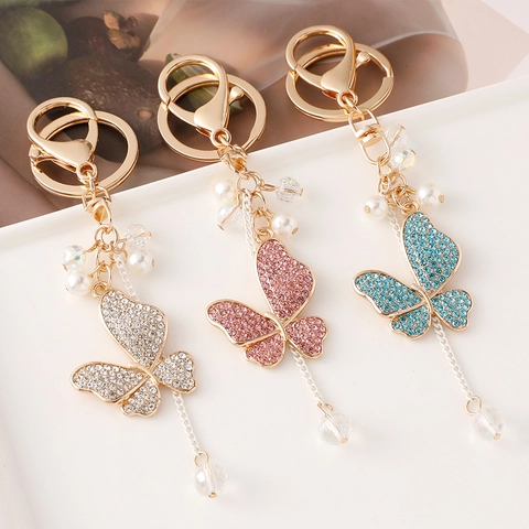 Portachiavi Farfalla in Lega Pendente Borsa Nappine Cristallo Strass Künstliche Perle Portachiavi Elegante Stile Coreano per Donna Regalo