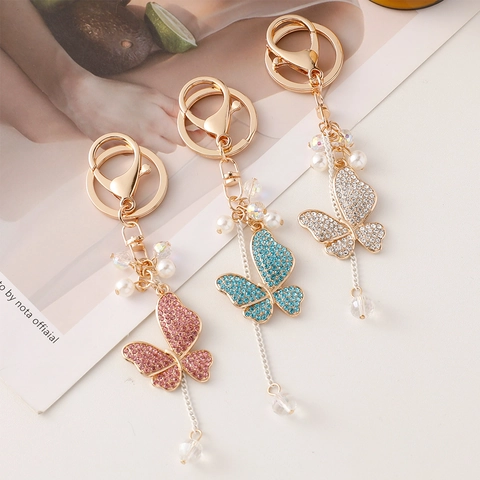 Portachiavi Farfalla in Lega Pendente Borsa Nappine Cristallo Strass Künstliche Perle Portachiavi Elegante Stile Coreano per Donna Regalo