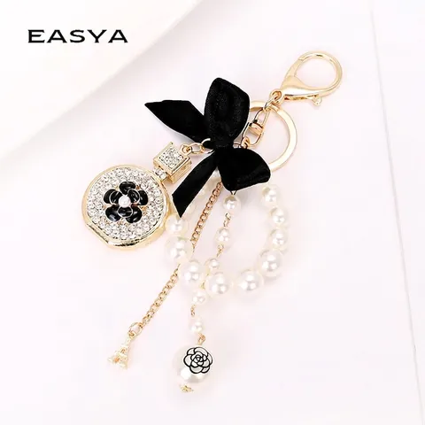 Eleganter Kamelie Schlüsselanhänger Parfümflasche Anhänger Mit Schleife Künstliche Perlenkette Gold Legierung Eiffelturm Damen Tasche Charme