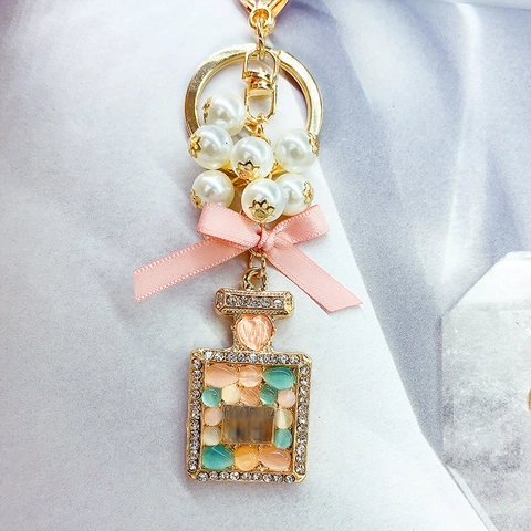 Elegant Perfume Bottle Keychain Pink Satin Ribbon Bow Artificial Pearl Alloy Rhinestone Inlaid Bag Charm Jewelry Gift For Women