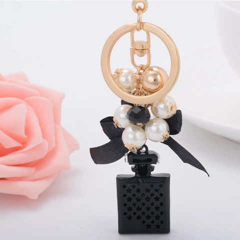 Elegante Llavero de Frasco de Perfume de Aleación de Zinc Con Lazo de Satén Perla Artificial Incrustación de Strass Colgante de Bolso Moda Regalo Mujer