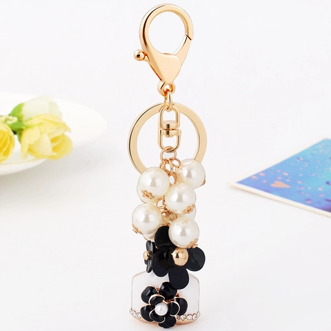 Koreanische Kamelie Blume Künstliche Perle Parfümflasche Schlüsselanhänger Mode Emaille Floral Legierung Strass Schlüsselring Damen Geschenk