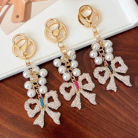 Elegante Portachiavi a Fiocco Con Perle Artificiali e Strass per Donna Cuore Traforato Lega Ciondolo per Borsa Gioielli Regalo