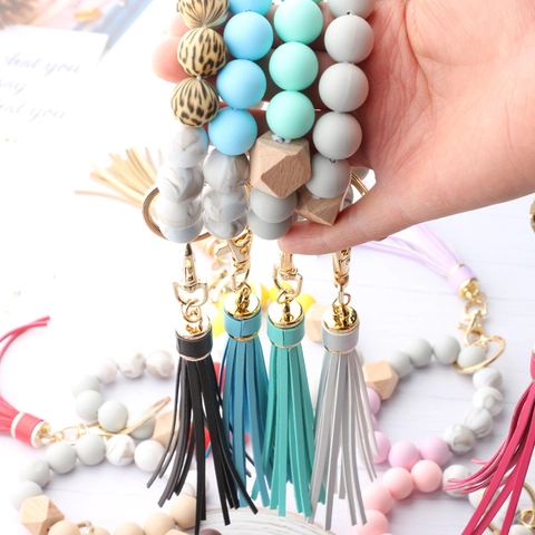 Μπρελόκ Καρπού Boho από Σιλικόνη και Ξύλο Για Γυναίκες Με Φούντα από Δέρμα PU Χρυσό Μεταλλικό Δαχτυλίδι Διακόσμηση Τσάντας