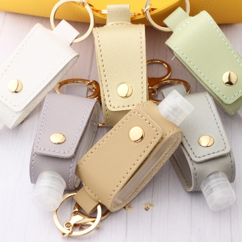 Juego de Llaveros con Funda de Cuero PU para Botella de Desinfectante de Manos Portátil con Gancho de Metal Botella Rellenable Transparente Pequeña Colgante de Bolsa