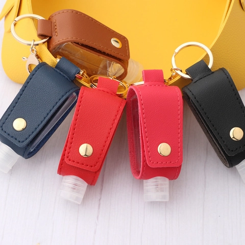 Juego de Llaveros con Funda de Cuero PU para Botella de Desinfectante de Manos Portátil con Gancho de Metal Botella Rellenable Transparente Pequeña Colgante de Bolsa