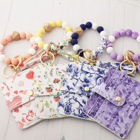 Bracciale Portachiavi in Perline di Silicone Con Porta Carte in Pelle PU Nappa Motivo Floreale Geometrico Donna