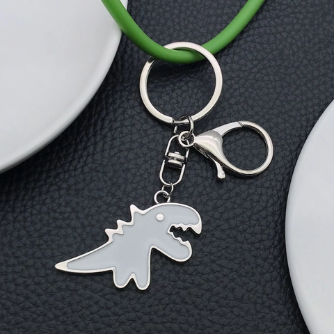 Leuke Cartoon Dinosauriër Sleutelhanger Emaille Zinklegering Tyrannosaurus Rex Sleutelring Voor Auto Tas Decoratie Hanger Cadeau Wit Zwart