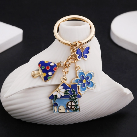 Niedlicher Emaille Pilzhaus Schmetterling Blumen Schlüsselanhänger Kreative Zinklegierung Cartoon Tasche Anhänger Für Damen Geschenk