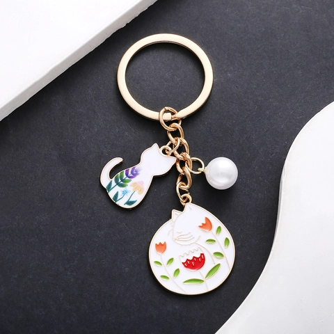 Simpatico Portachiavi con Gatto Bianco in Smalto e Perla Artificiale Ciondolo per Borsa Gattino con Fiori per Donna Bambini