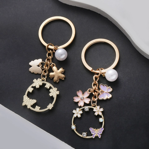 Portachiavi Dolce Farfalla Fiore Traforato Con Perla Artificiale Strass Lega di Zinco Smalto Ciondolo Borsa Donna Gioielli Regalo