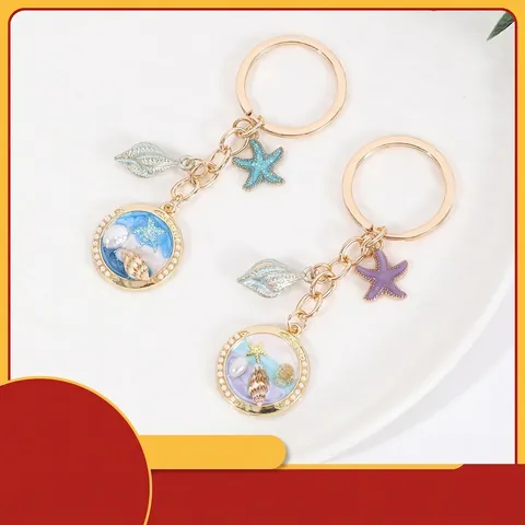 Llavero de Metal Tema Océano Oro Aleación Estrella de Mar Concha Resina Goteo de Pegamento Amuleto de Bolso para Mujeres Niños