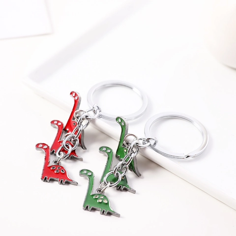 Portachiavi Creativo con Dinosauro a Cartoni Animati in Lega di Zinco Smaltato Ciondolo per Zaino Regalo di Compleanno