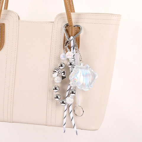 Elegante Ciondolo per Borsa a Forma di Conchiglia in Pelle PU Con Corda Intrecciata Perla Artificial Sintetica Fiocco Gancio a Cuore Portachiavi