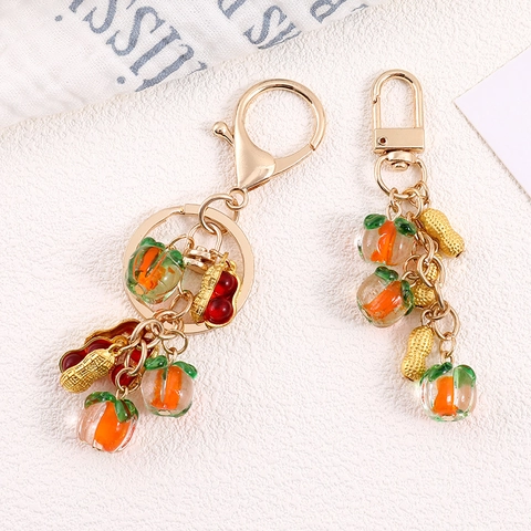 Porte-clés Créatif Kaki Cacahuète en Alliage Plaqué Or Charme de Sac Succès Pendentif en Résine Kaki Accessoires de Clés