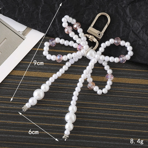 Porte-clés Nœud Papillon en Perle Artificielle Artisanal Bijou de Sac à la Mode Perlé Fermoir Mousqueton en Alliage Décoration de Sac à Dos Femme