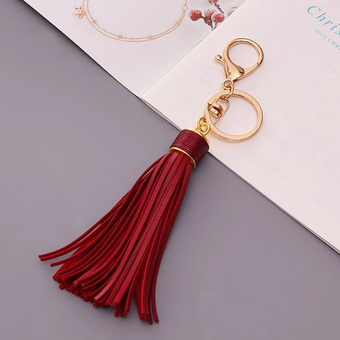 Portachiavi alla Moda con Nappina in Pelle PU e Chiusura a Moschettone in Metallo Ciondolo per Borsa da Donna Accessori Chiave Auto