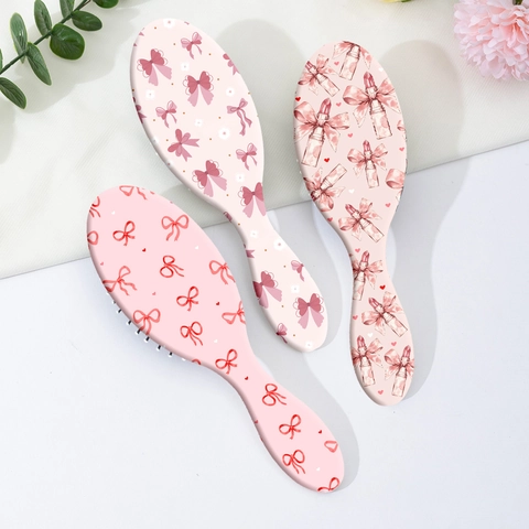 Simpatica Spazzola per Capelli con Cuscino d'Aria Rosa e Fiocco Massaggio al Cuoio Capelluto Pettine Districante in ABS Portatile per Donna