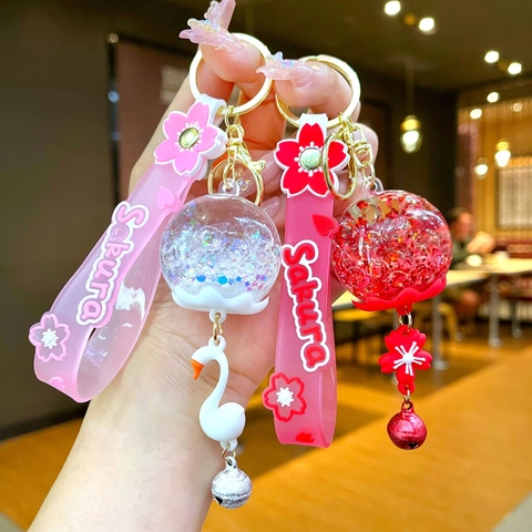 Cute Sakura Cherry Blossom Quicksand Keychain For Women Girls Glow In The Dark Sequin Ball Bag Pendant With Bell Silicone Wristlet