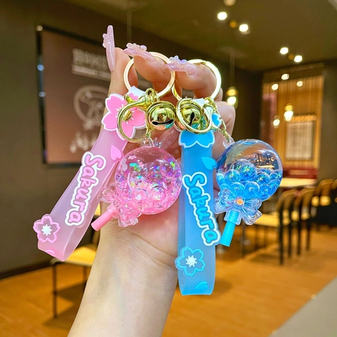 Kreative Sakura Lollipop Öl Treibsand Schlüsselanhänger Leuchtende Acryl Flüssigkeit Flasche Tasche Anhänger Geschenk Für Damen Mädchen Kinder