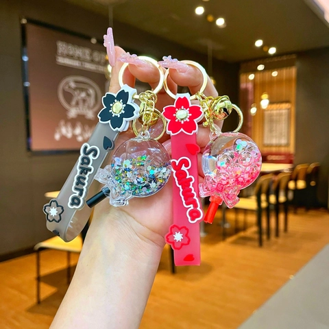 Kreative Sakura Lollipop Öl Treibsand Schlüsselanhänger Leuchtende Acryl Flüssigkeit Flasche Tasche Anhänger Geschenk Für Damen Mädchen Kinder