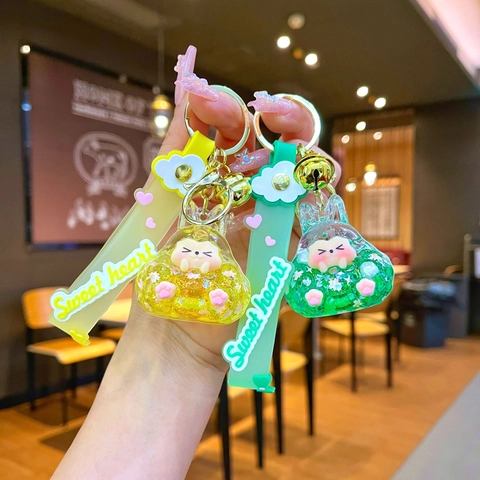 Portachiavi con Sabbie Mobili Liquide a Forma di Coniglio in Acrilico Riempito d'Olio Ciondolo Borsa Animale Luminoso con Cinturino in Silicone e Campanellino
