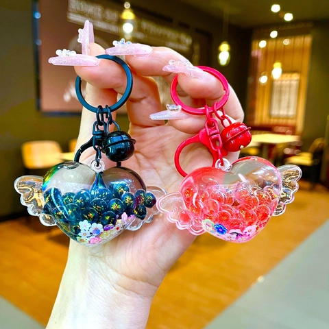 Simpatico Portachiavi a Forma di Cuore con Ali Sabbie Mobili Luminoso in Acrilico Pendente per Borsa con Campanello Regalo