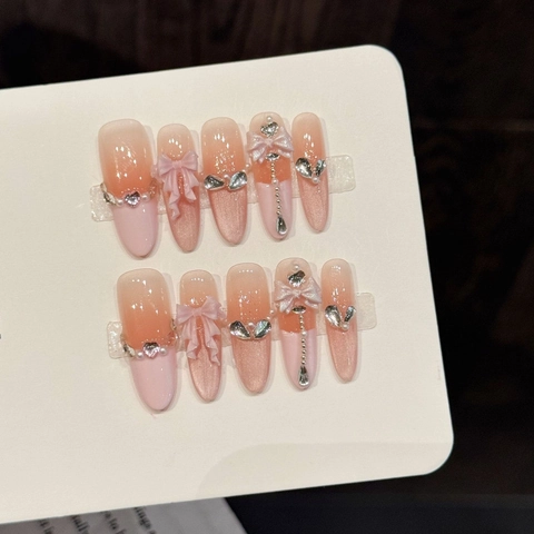 Unghie Finte Autoadesive Fatte a Mano Sfumatura Arancio Rosa Fiocco Occhio di Gatto Strass Perla Artificiale Ovale Lungo Set