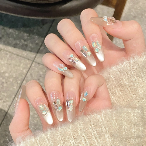 Uñas Postizas Hechas a Mano Efecto Ojo de Gato Forma Ovalada Larga Color Champaña Nude Con Dijes de Strass Estrella Corazón Lujo Para Mujer