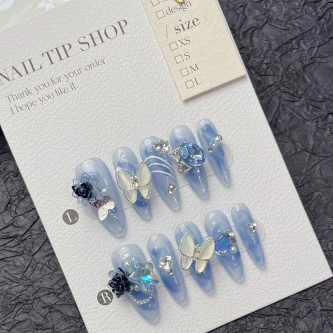 Faux Ongles à Presser Marbre Bleu Faits Main Luxe Papillon 3D Strass Stiletto Ongles Longs Avec Perles Set Manucure pour Femme