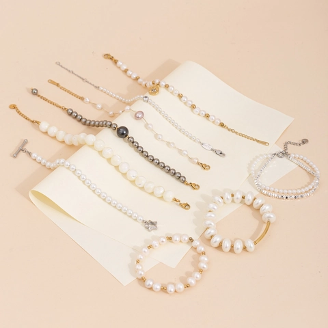Elegante Bracciale di Perle Artificiali per Donna Oro Argento Lega Strass Stella Pendente Bracciale Charm Moda Pendolare Gioielli Regalo