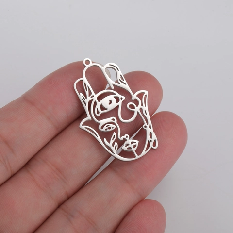 Pendenti a Forma di Mano di Hamsa con Viso Astratto in Acciaio Inossidabile Occhio Traforato Accessori per Gioielli Fai da Te